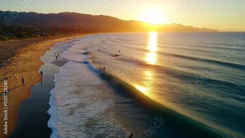 Golden Sunset over Ocean Beach with Surfers