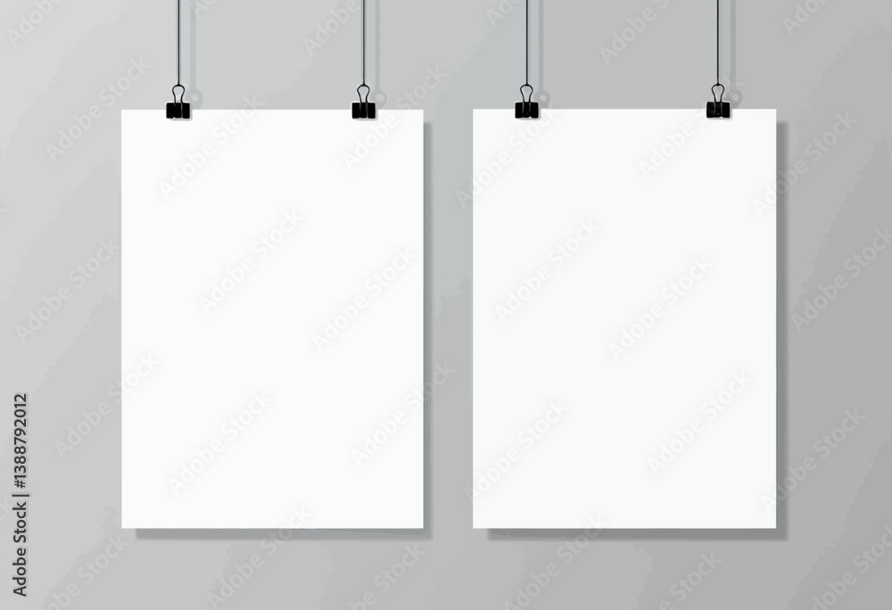 Two White Posters Hanging with Black Clips on Gray Wall Two White Posters Hanging with Black Clips on Gray Wall