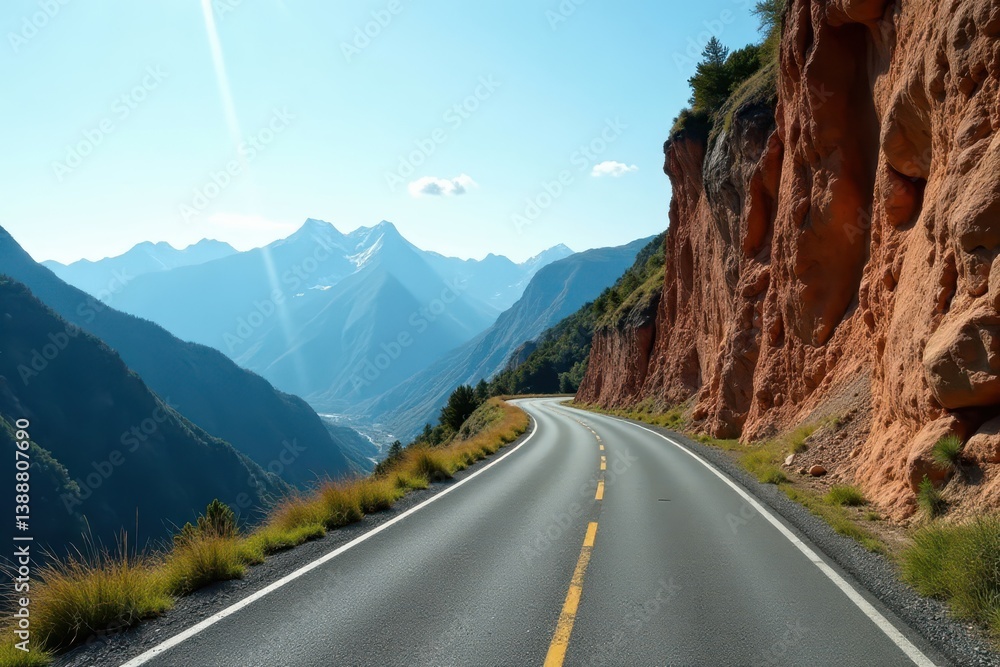 Fototapeta premium Narrow asphalt lane, steep cliffside, distant peaks, bend, peaks, clouds