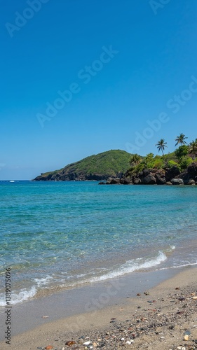 A stunning sea view with a sandy shore, showcasing a vibrant landscape with vivid colors. Tranquil waves meet golden sands under a breathtaking sky, perfect for travel and nature themes. 