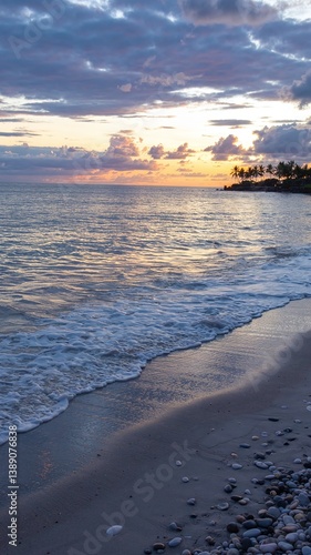 A stunning sea view with a sandy shore, showcasing a vibrant landscape with vivid colors. Tranquil waves meet golden sands under a breathtaking sky, perfect for travel and nature themes. 