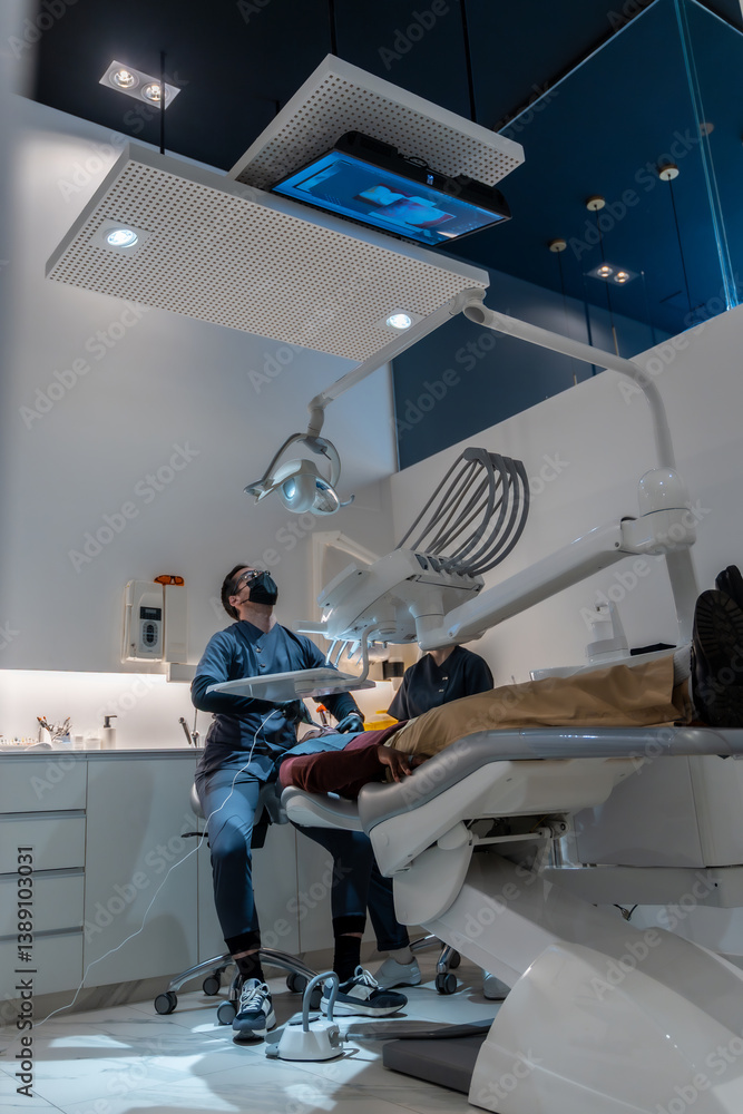 Dentist performing checkup on patient in modern dental clinic