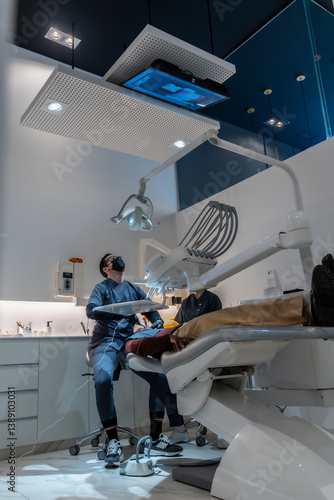 Obraz na płótnie Dentist performing checkup on patient in modern dental clinic w salonie