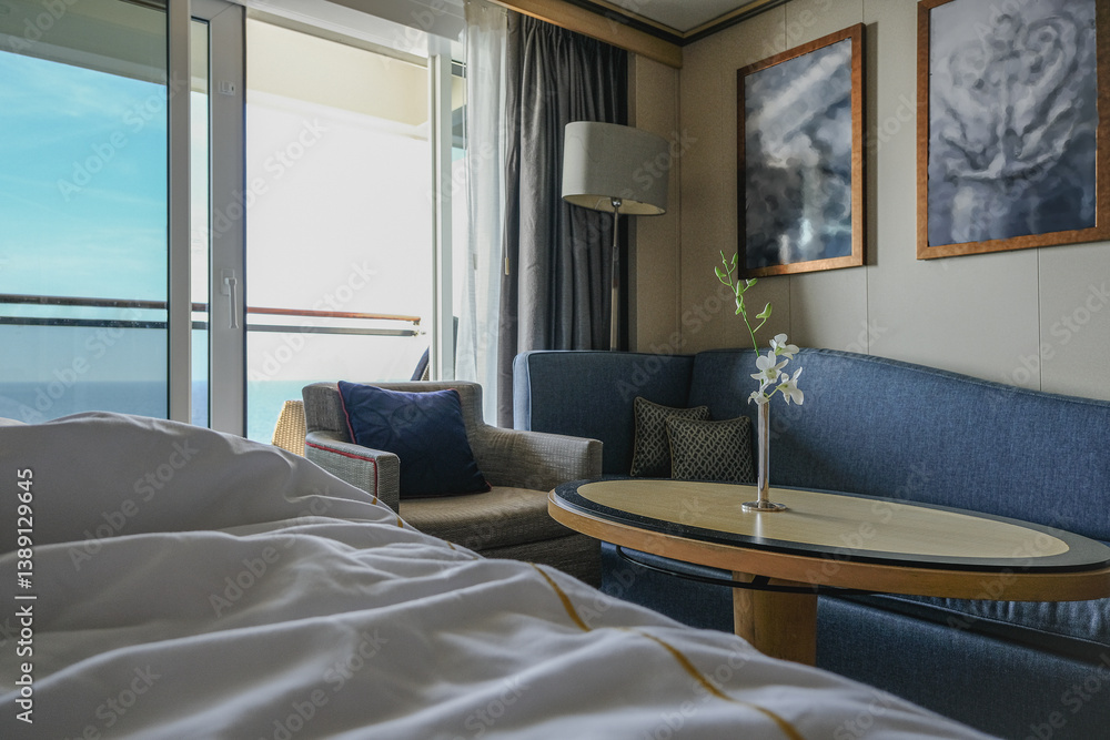 Luxurious ocean view or oceanview or outside balcony veranda cabin stateroom suite queen king double bed on luxury ocean liner cruiseship cruise ship in classic classy interior Art Deco style design