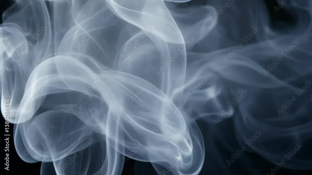 Abstract swirls of hazy white smoke gracefully billow against a dark background, creating a sense of mystery and ethereal beauty. Abstract swirls of hazy white smoke gracefully billow against a dark background, creating a sense of mystery and ethereal beauty.