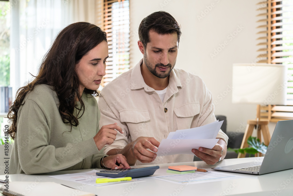 Couple budgeting and calculating tax with laptop at home, managing finance and planning for longterm investment Couple budgeting and calculating tax with laptop at home, managing finance and planning for longterm investment