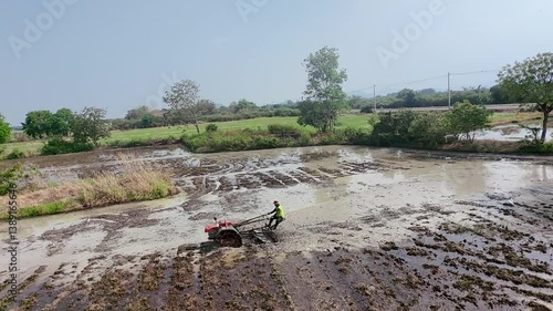 High angle footage of soil preparation before rice planting.