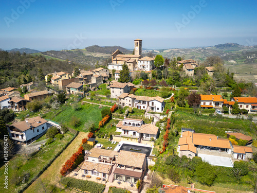 Aerial image, taken by drone, of the village of Fortunago, a small village in the hilly area of Oltrepo Pavese (Lombardy Region, Northern Italy), in the list of the most beautiful villages of Italy.