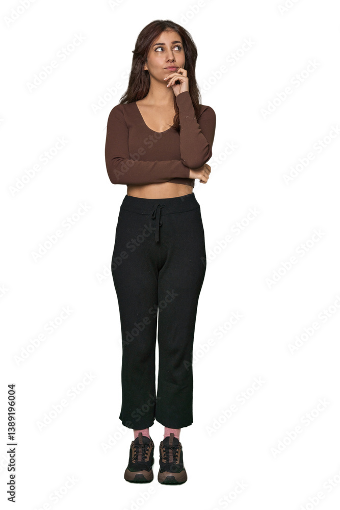 Middle Eastern woman, full body studio looking sideways with doubtful and skeptical expression. Middle Eastern woman, full body studio looking sideways with doubtful and skeptical expression.