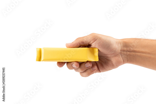 Male hand holding yellow snack bar mockup isolated no background cutout