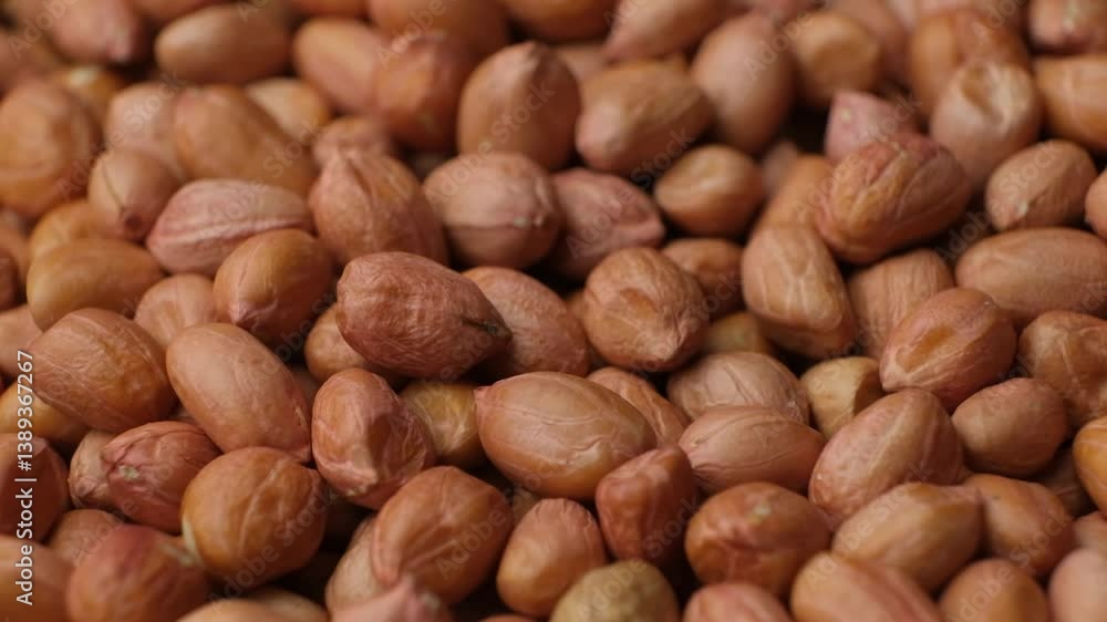 Peanut background, lots of raw brown peanuts close-up. Peanut background, lots of raw brown peanuts close-up.