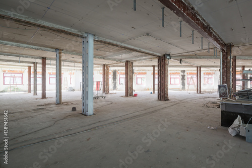 Industrial space under renovation with exposed beams and materials