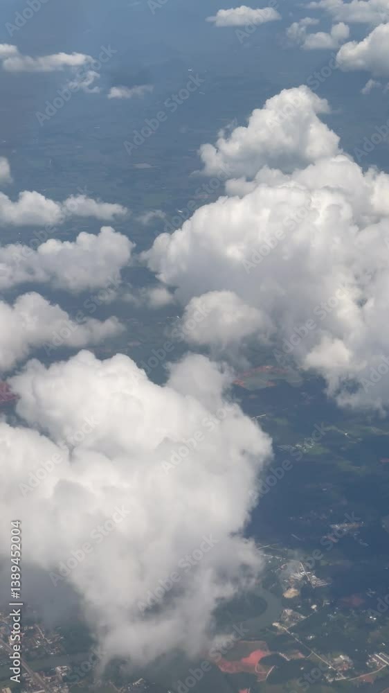 View from an airplane window showcasing a sunny sky, View out plane window of fall trees, in Thailand View from an airplane window showcasing a sunny sky, View out plane window of fall trees, in Thailand