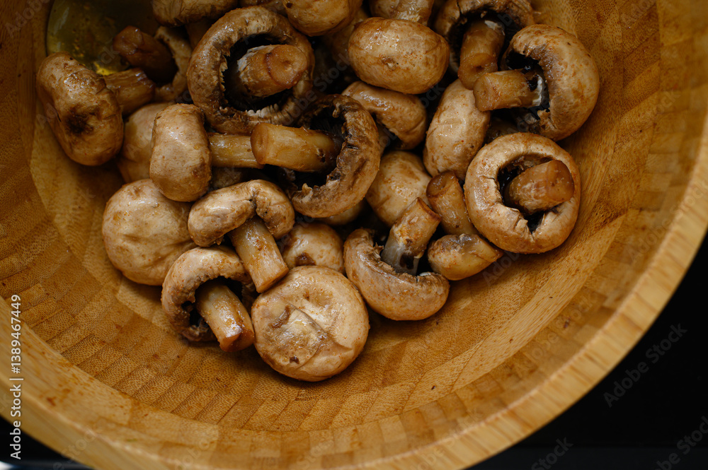 Marinated champignon mushrooms in a wooden bowl, ready for grilling. Fresh, rustic ingredients for outdoor BBQ. Natural light, healthy plant-based cooking scene. Marinated champignon mushrooms in a wooden bowl, ready for grilling. Fresh, rustic ingredients for outdoor BBQ. Natural light, healthy plant-based cooking scene.