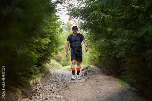 Obraz na płótnie Man hiking in forest trail......... w salonie
