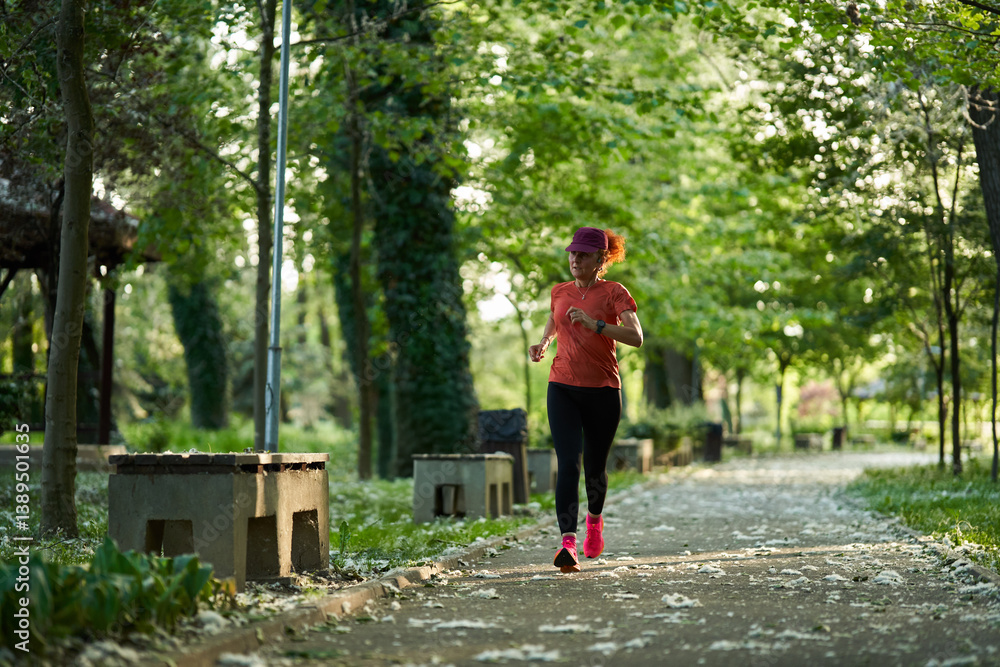 Woman jogging in summer park.........