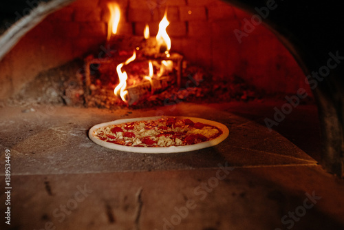 Wood-Fired Oven with Pizza Cooking Over Flames in Rustic Kitchen