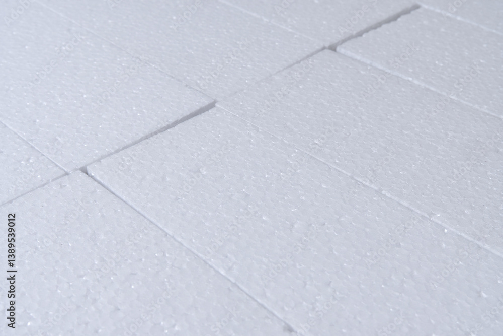 Fototapeta premium Foam board texture background. Close-up cut foam sheets texture. Plastic, sponge, soft packaging material, white, blank, rough, abstract for texture, cover. Texture background of white foam board.