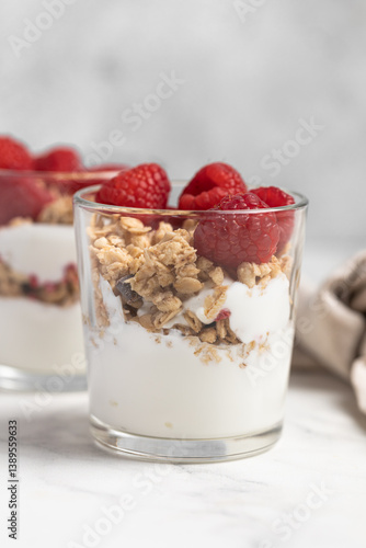 yogurt with granola and raspberries