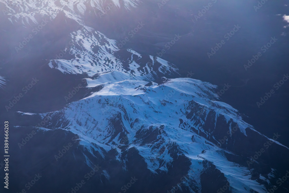 Mountains blanketed in clouds, aerial view