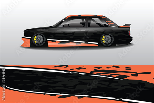 Sleek black sports car with dynamic graphics parked against a minimalist backdrop