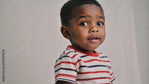 A young boy shows surprise and wonder on his face, ideal for illustrations and designs where innocence and curiosity are the themes