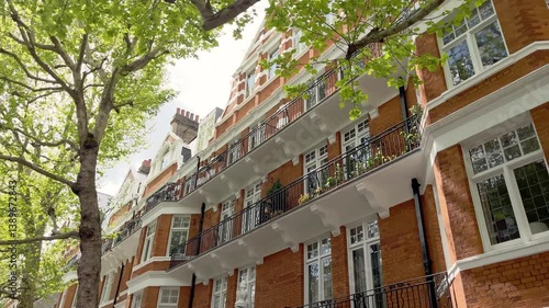 Bottom view of traditional, historical, typical buildings in London. It shows British architectural style.
