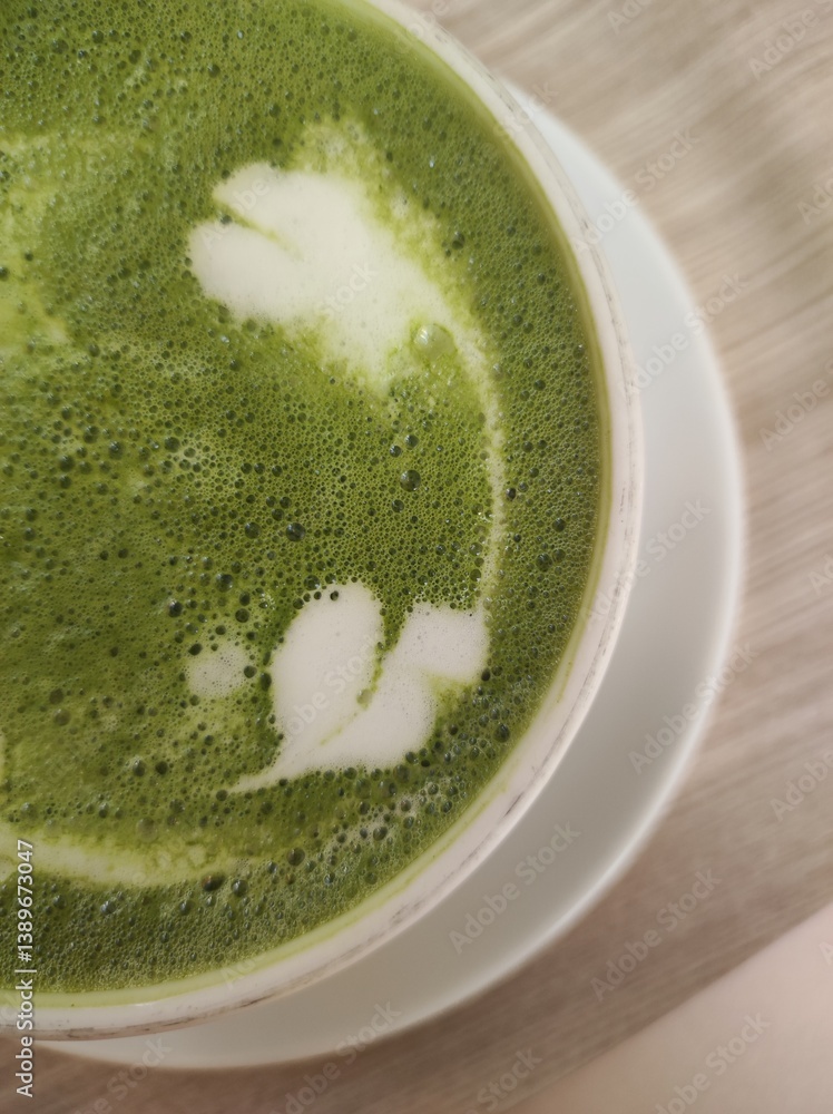 Green tea matcha latte, top view, close-up