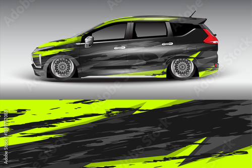 Sleek modified car with bold graphic design parked against a gradient background