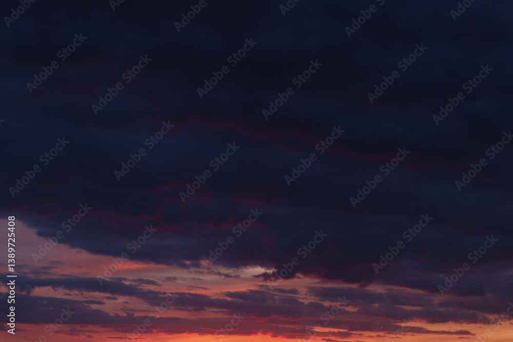 Background of purple evening clouds with pink stripes at the bottom Background of purple evening clouds with pink stripes at the bottom