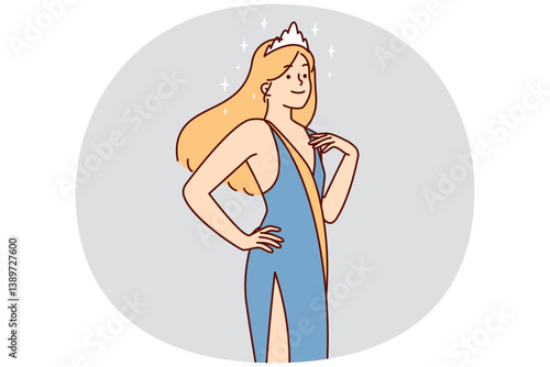 Cheerful woman in evening dress with crown on hair participating in beauty contest or fashion show