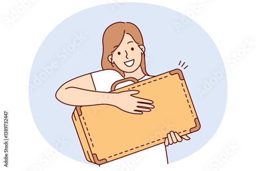 Smiling woman showing off old suitcase to show ready to travel by plane or train