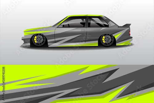 Sleek modified car with vibrant yellow and gray graphics parked against a minimalist background