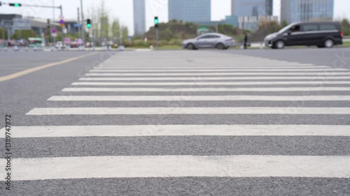 Wallpaper Mural pedestrian zebra crossroad. Chengdu city road intersection. Text on asphalt near crosswalk Torontodigital.ca