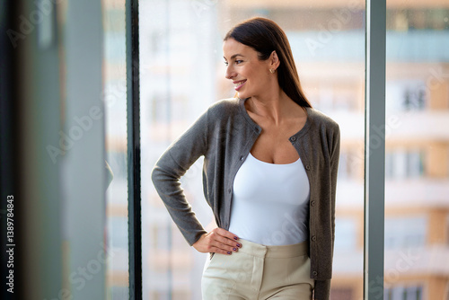Mid aged businesswoman in modern office Free Download Mid aged businesswoman in modern office - GFXLoad