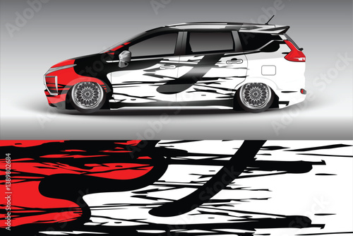 Stylish modified car with dynamic graphic design parked against a minimalist gray background