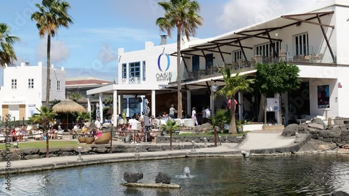 Wallpaper Mural Playa Blanca Spain 03 13 2025 Marina Rubicon, a vibrant marina in Playa Blanca, Lanzarote. A lively harbor with yachts, waterfront bars, restaurants, and a local market. Torontodigital.ca