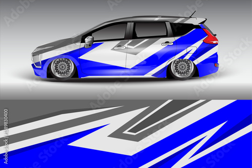 Stylishly customized car with vibrant blue and gray design parked against a minimalist background