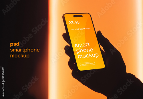 Hand holding a smartphone on orange background