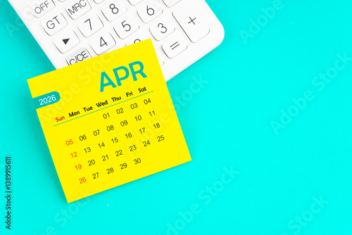 April 2026 calendar page with calculator on blue background.