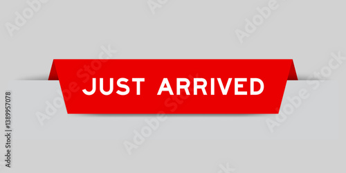 Red color inserted label with word just arrived on gray background