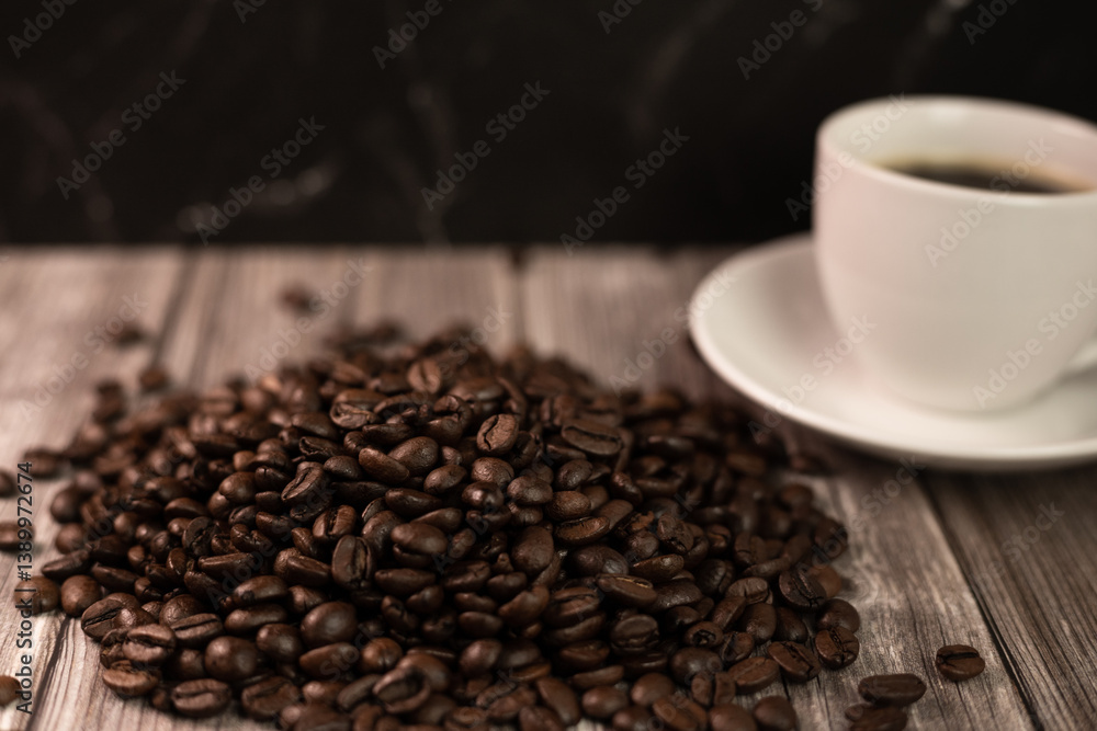 Fototapeta premium Espresso coffee and coffee beans on the table. Coffee in a white cup