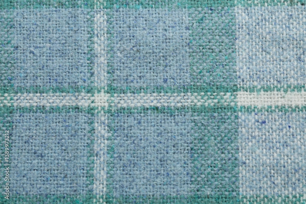 Fototapeta premium Turquoise woolen fabric with geometrical pattern as background, top view