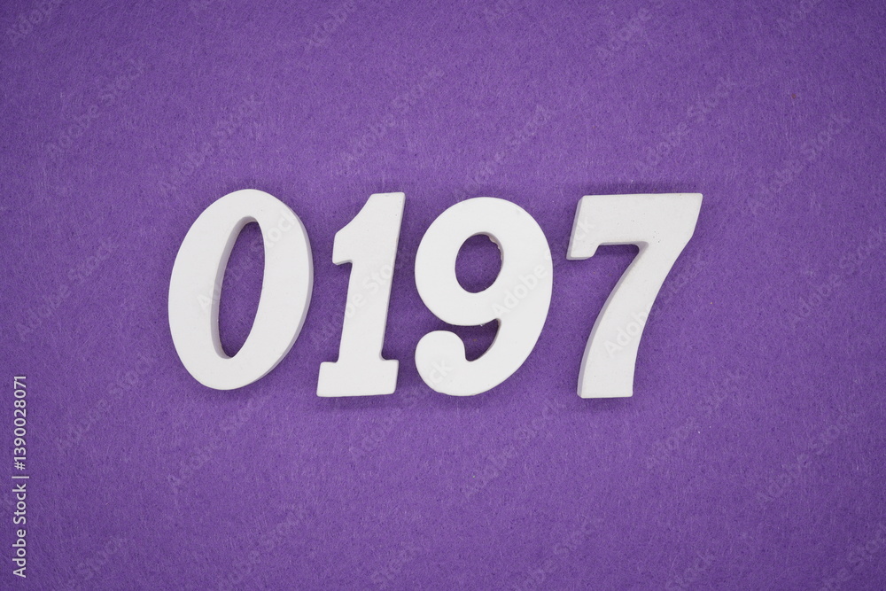 The numbers are made of white painted wood placed on a purple paper background. The numbers are made of white painted wood placed on a purple paper background.