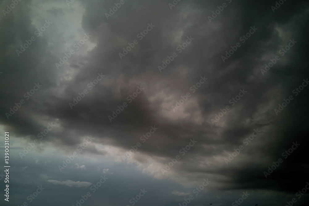 Dramatic dark storm thundercloud rain clouds on black sky background. Dark thunderstorm clouds rainny landscape. Meteorology danger windstorm disaster climate. Dark cloudscape storm disaster gray sky