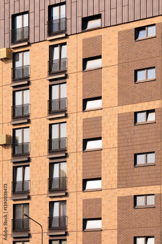 Naklejka premium City view on a sunny day. Modern buildings, walls and windows. 