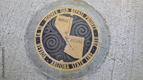 Bronze plaque marking the Arizona - Nevada state line, Hoover Dam, Arizona, Nevada, USA