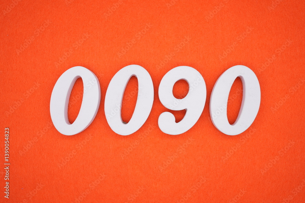 The numbers are made of white painted wood placed on an orange paper background. The numbers are made of white painted wood placed on an orange paper background.