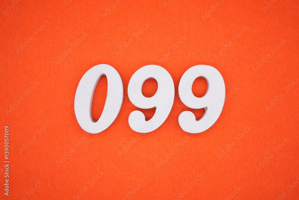 The numbers are made of white painted wood placed on an orange paper background. The numbers are made of white painted wood placed on an orange paper background.