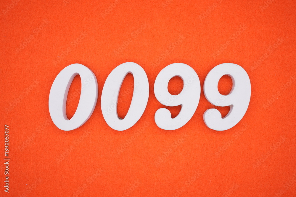 The numbers are made of white painted wood placed on an orange paper background. The numbers are made of white painted wood placed on an orange paper background.